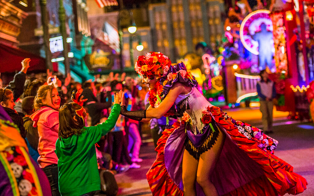 Free Mardi Gras Deal at Universal Studios where the music is jamming and pretty girls are throwing beads