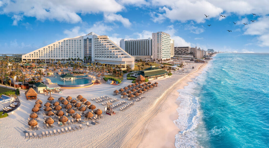 Cancun beach with resorts near the blue ocean