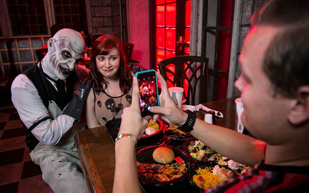 ScareActor Dining Experience Guests with actor at table 